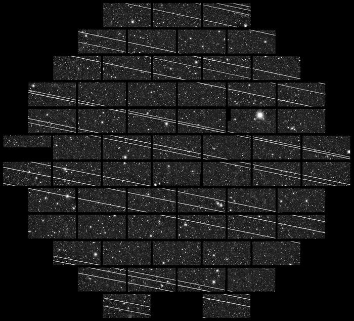 Night sky image with trails of satellites
